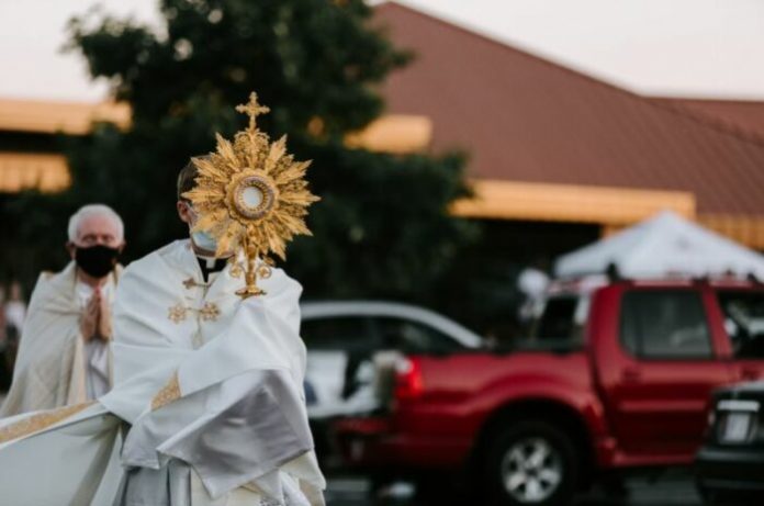 American priests with blessed sacraments