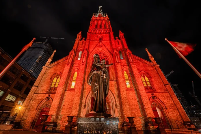 St. Michael's Cathedral Basilica in downtown Toronto is illuminated in red for Red Wednesday (Credit Michael Swan Catholic Register)