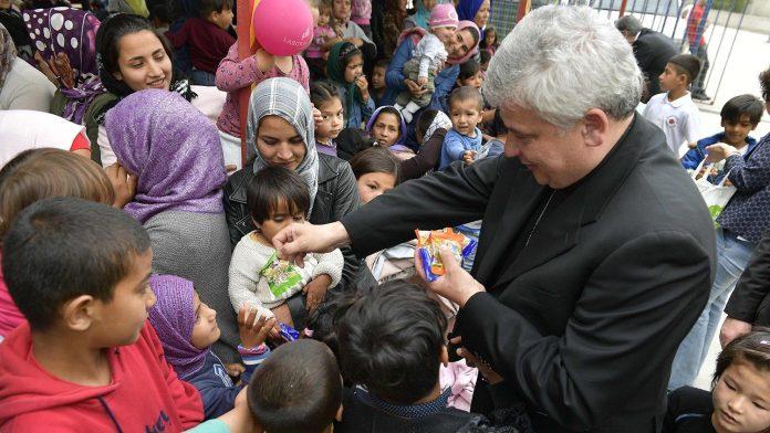 Cardinal Krajewski with refugees on the Greek island of Lesbos in 2019 (Credit Vatican Media)