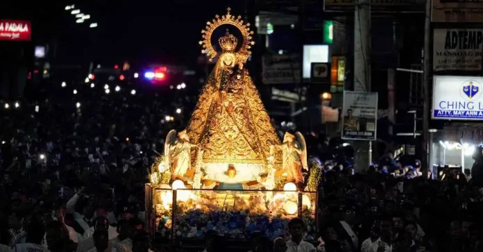 People join the procession to honor Our Lady of Manaoag in the northern Philippine province of Pangasinan during the centennial celebration of the canonical coronation on April 22. (Photo: Joachim Nigel Z. Tanglao/The Varsitarian)