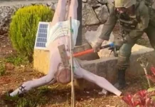 Israeli Army Confirms Authenticity of Image Showing Soldier Striking Jesus Statue in Southern Lebanon An Israeli soldier is seen smashing a statue of Jesus Christ in southern Lebanon with a sledgehammer. (Photo : Facebook/Addis Standard)