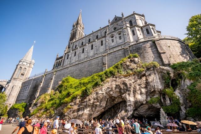 Lourdes The Basilica of the Immaculate Conception above the grotto in Lourdes, France (Photo by Nick Castelli on Unsplash)