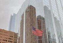 Bank Customer service hangs up on Pope Leo XIV USA flag at Bank of America (Photo by Clémentine CLAUDEL on Unsplash)