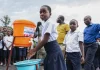 Ebola Outbreak in Central Africa Faces Prolonged Battle Amid Conflict, Misinformation, and Resource Shortages Children in the DRC wash their hands before going to class. In 2019, handwashing kits were distributed to schools in order to prevent the spread of Ebola. (Credit CRS)