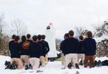 Pope Urges Catholic Communities to Reignite Youth Faith Amid Rising “Spiritual Poverty” Youth at a mass on a snow capped mountian (Photo by Maël BALLAND on Unsplash)