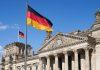Catholic Church Launches “Vote Consciously” Campaign as Far-Right Surges in Saxony-Anhalt Close-up Deutscher Reichstag with german national flags (Photo by Norbert Braun on Unsplash)