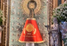 Virgin of Pilar Receives Red Mantle Honoring Persecuted Christians as ACN Spain Marks 60 Years Our Lady of the Pillar wearing the mantle donated by Aid to the Church in Need in Spain. | Credit: ACN Spain.