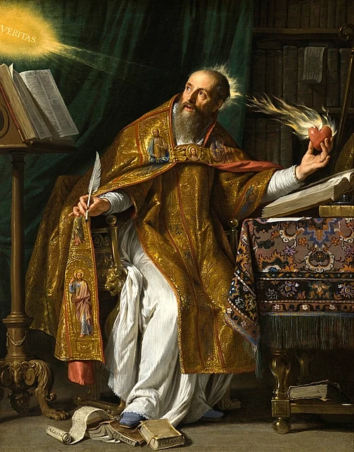 500px-Saint_Augustine_by_Philippe_de_Champaigne Bearded saint in ornate gold vestments sits at a desk, writing with a quill, while his right hand holds a flaming heart; a glowing “Veritas” light shines nearby.